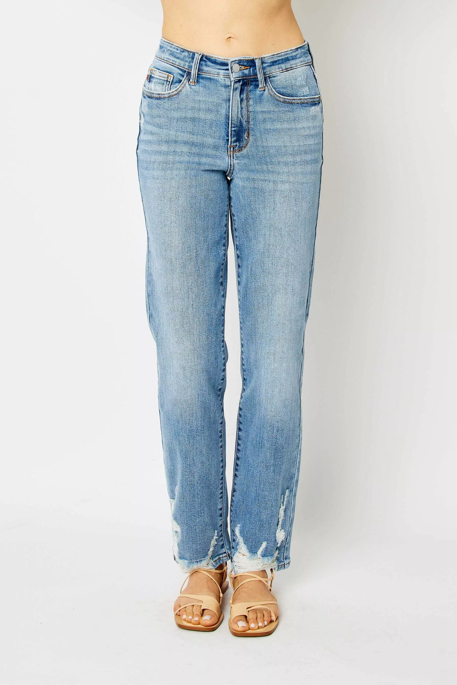 Light blue jeans worn by a person on a white background
