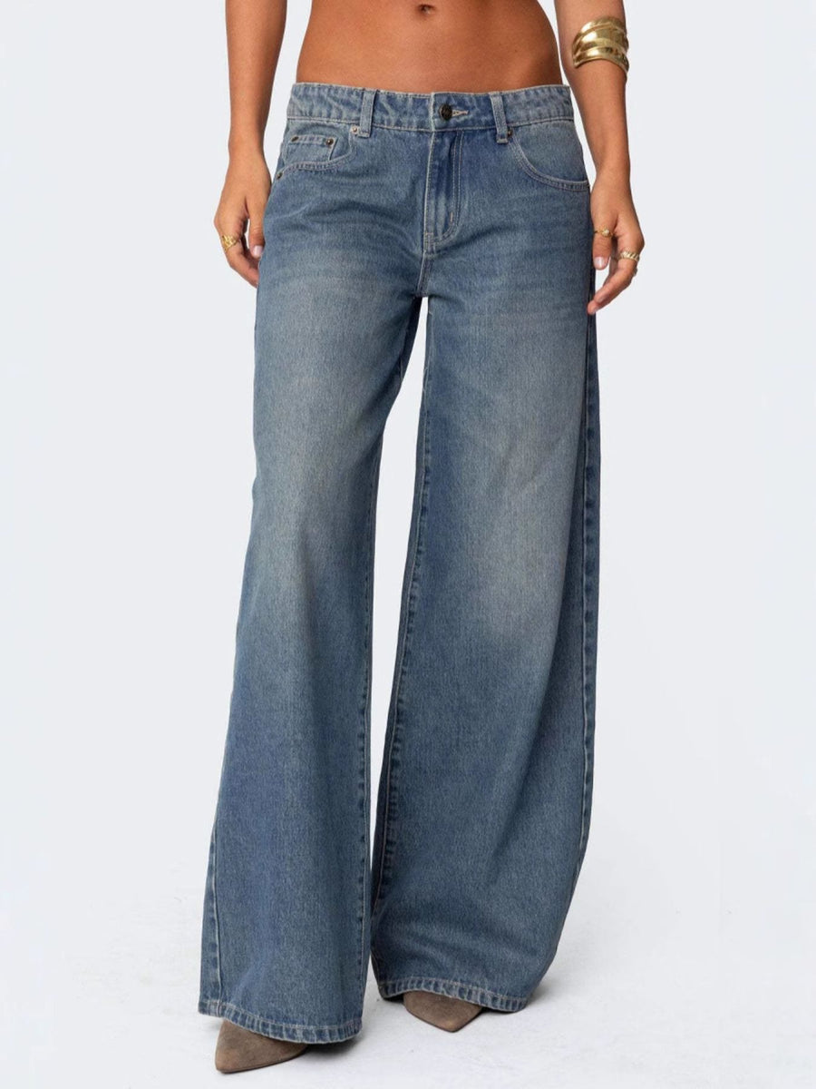 Wide-leg jeans worn by a person on a white background