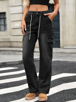 Person wearing black cargo pants on a city street