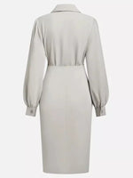 Beige dress with long sleeves on a white background