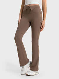 Brown pants worn by a person on a white background