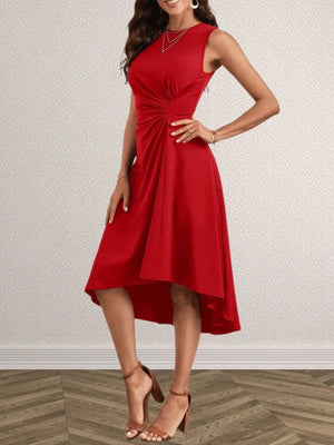 Woman wearing a red dress against a plain background