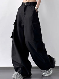 Black wide-leg pants worn by a person on a plain background