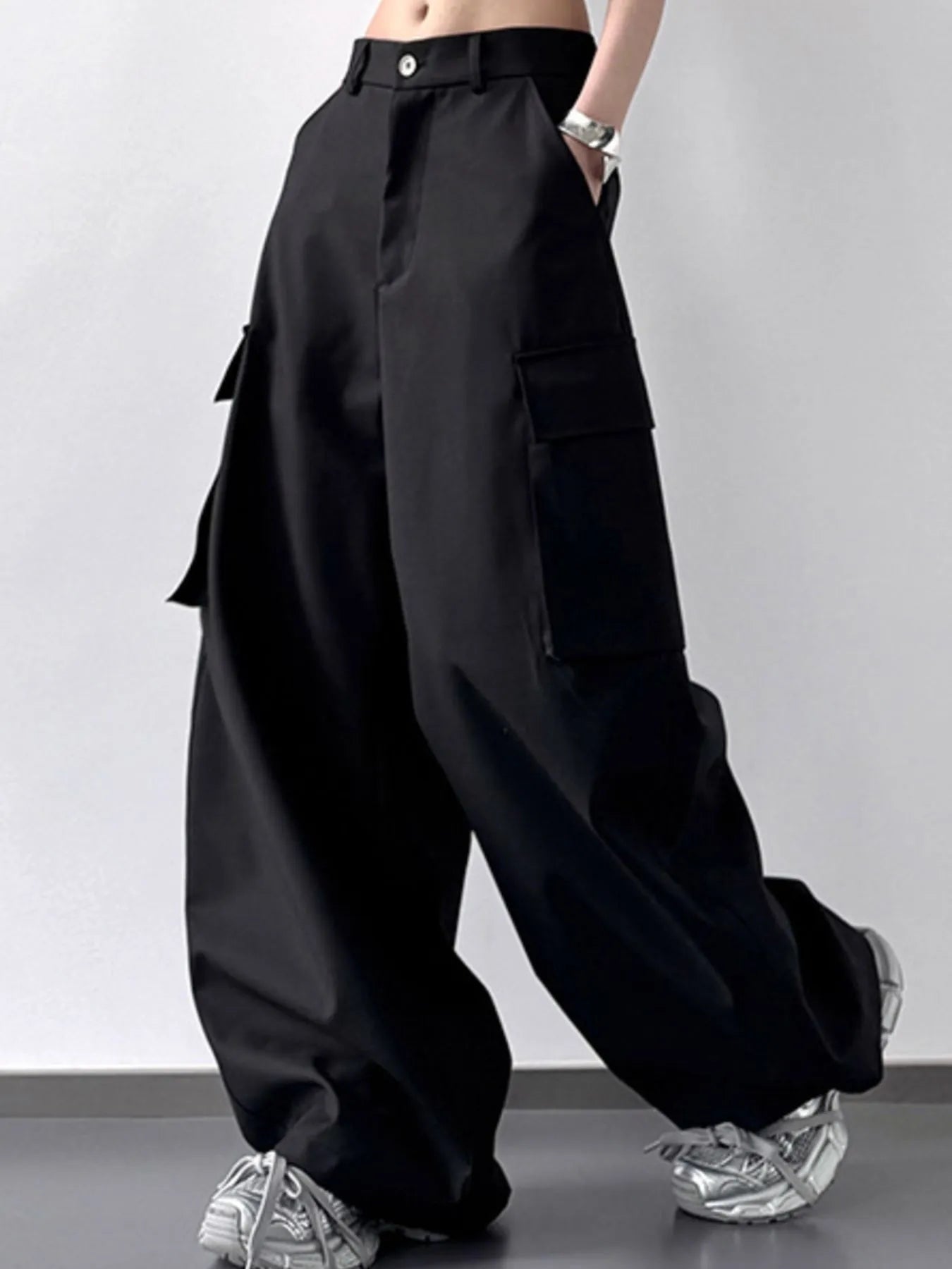 Black wide-leg pants worn by a person on a plain background