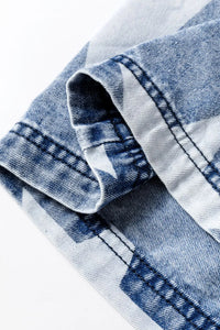 Close-up of blue denim fabric with a white background