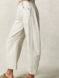 Light-colored pants on a plain background