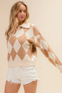 Woman wearing a beige and white argyle patterned sweater vest with white shorts on a beige background