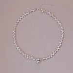 Pearl necklace on a beige background