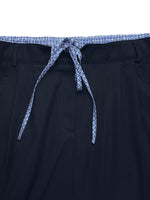 Navy shorts with a patterned drawstring on a white background