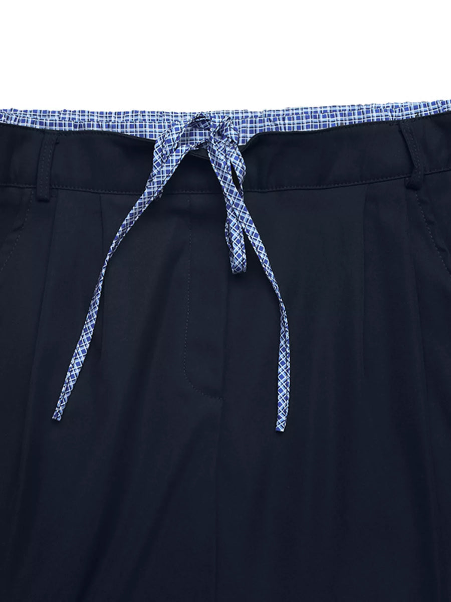Navy shorts with a patterned drawstring on a white background