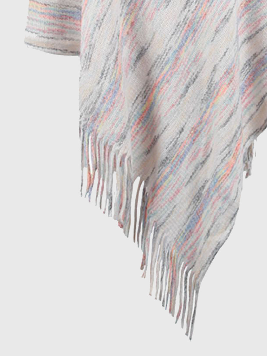 Multicolored striped poncho with fringe on a light gray background