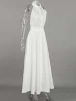White dress on a mannequin against a gray background