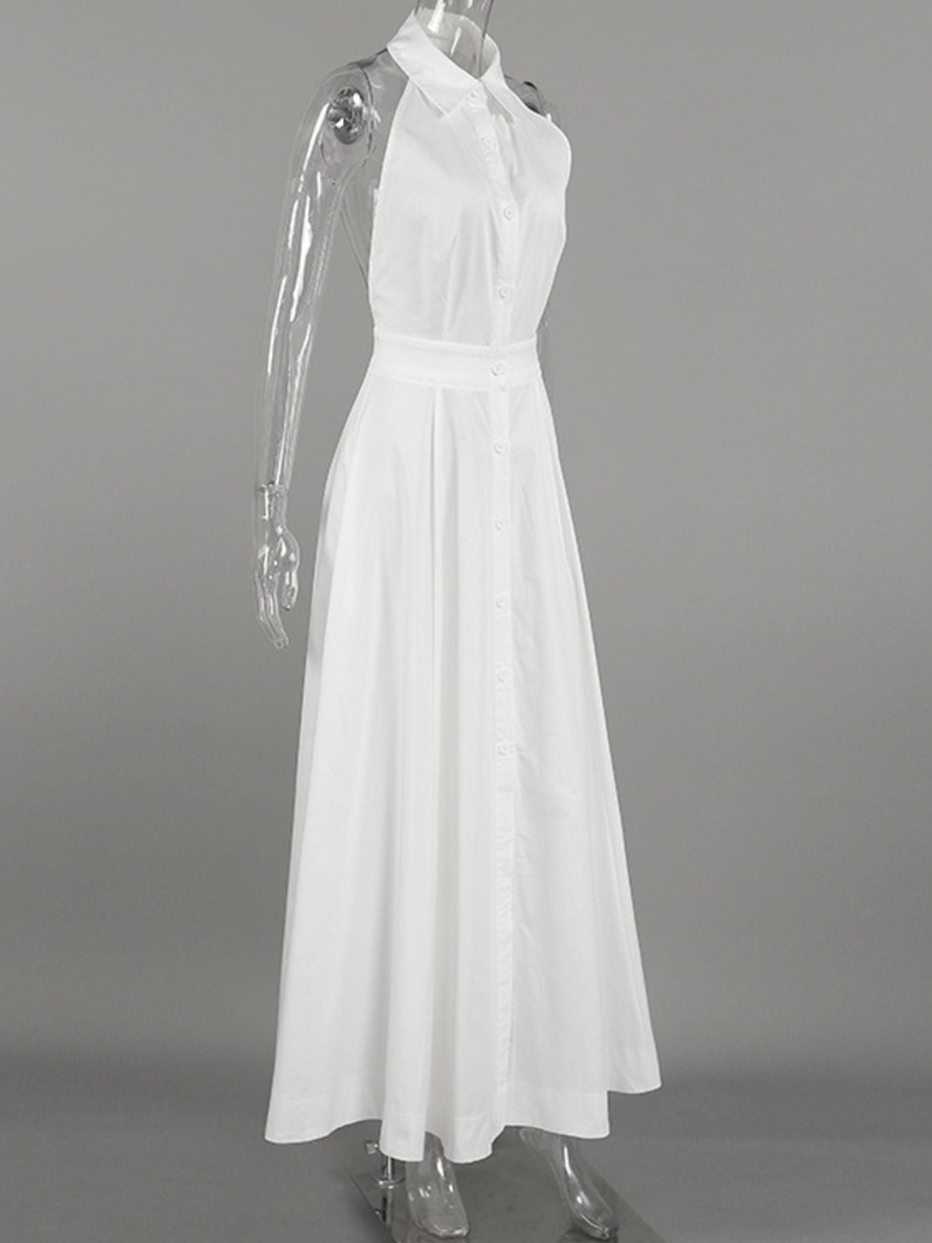 White dress on a mannequin against a gray background