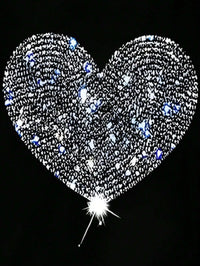Heart-shaped balloon with rhinestones against a black background