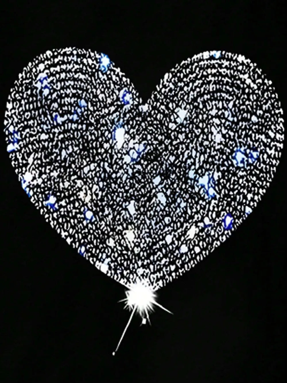 Heart-shaped balloon with rhinestones against a black background