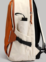 Beige backpack with brown leather accents on a gray background