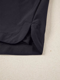 Close-up of a dark blue fabric corner on a beige background
