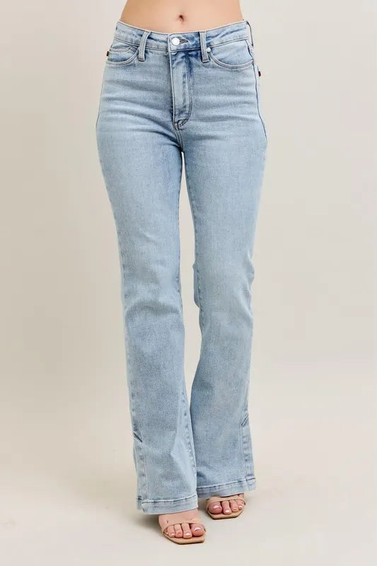 Light blue jeans on a plain background
