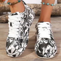 Black and white patterned sneakers on a wooden floor