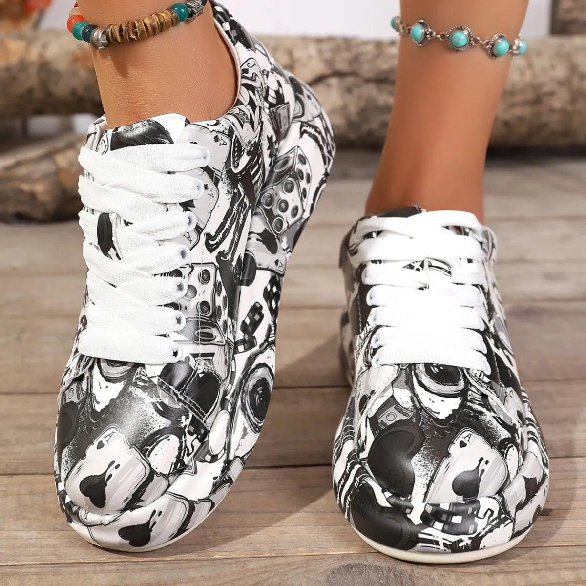 Black and white patterned sneakers on a wooden floor