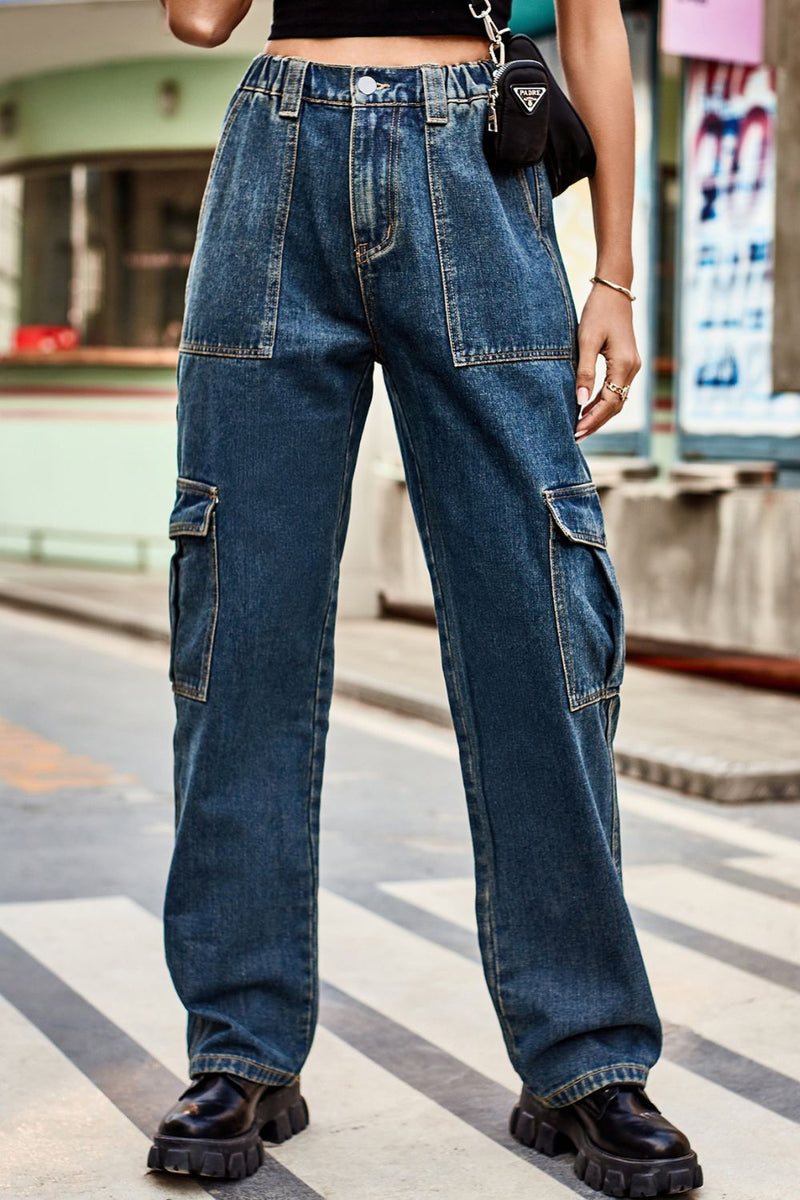 Person wearing blue jeans on a city street
