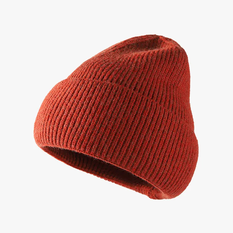 Red knit beanie on a white background