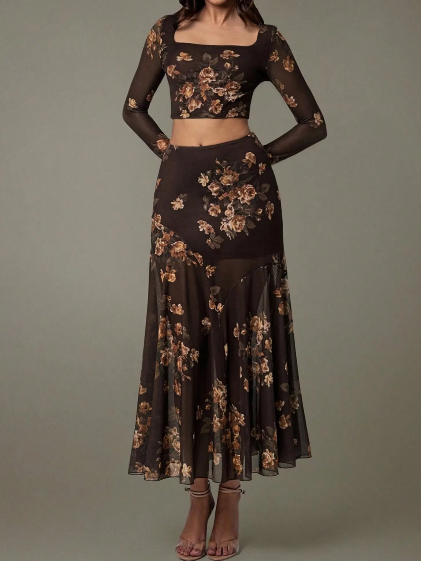 Black floral two-piece outfit on a gray background