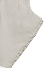 Close-up of a light gray fabric with textured edge on a white background