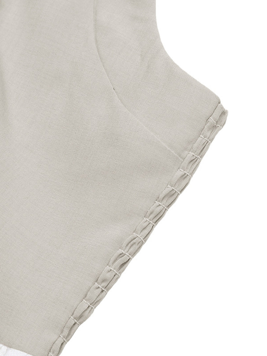 Close-up of a light gray fabric with textured edge on a white background