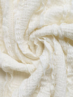 Close-up of a textured white fabric