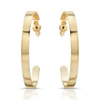 A pair of flat wide flat recycled brass hoop earrings with a 14k yellow gold finish.