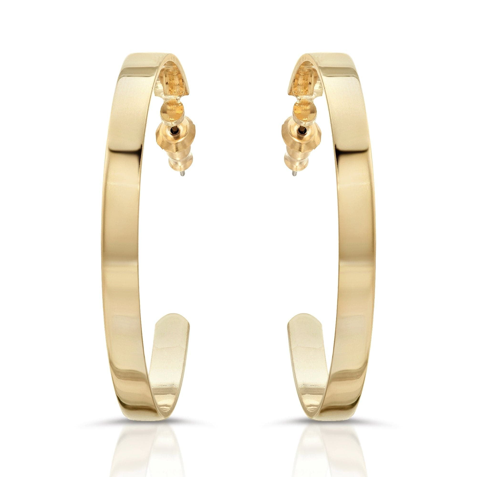 A pair of flat wide flat recycled brass hoop earrings with a 14k yellow gold finish.