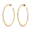 A pair of gold-colored hoop earrings with a square wire design, crafted from recycled brass.