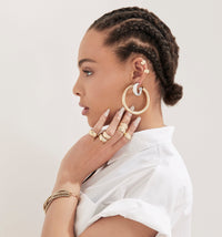 Woman showing 2" Ryan Hoops in her left ear