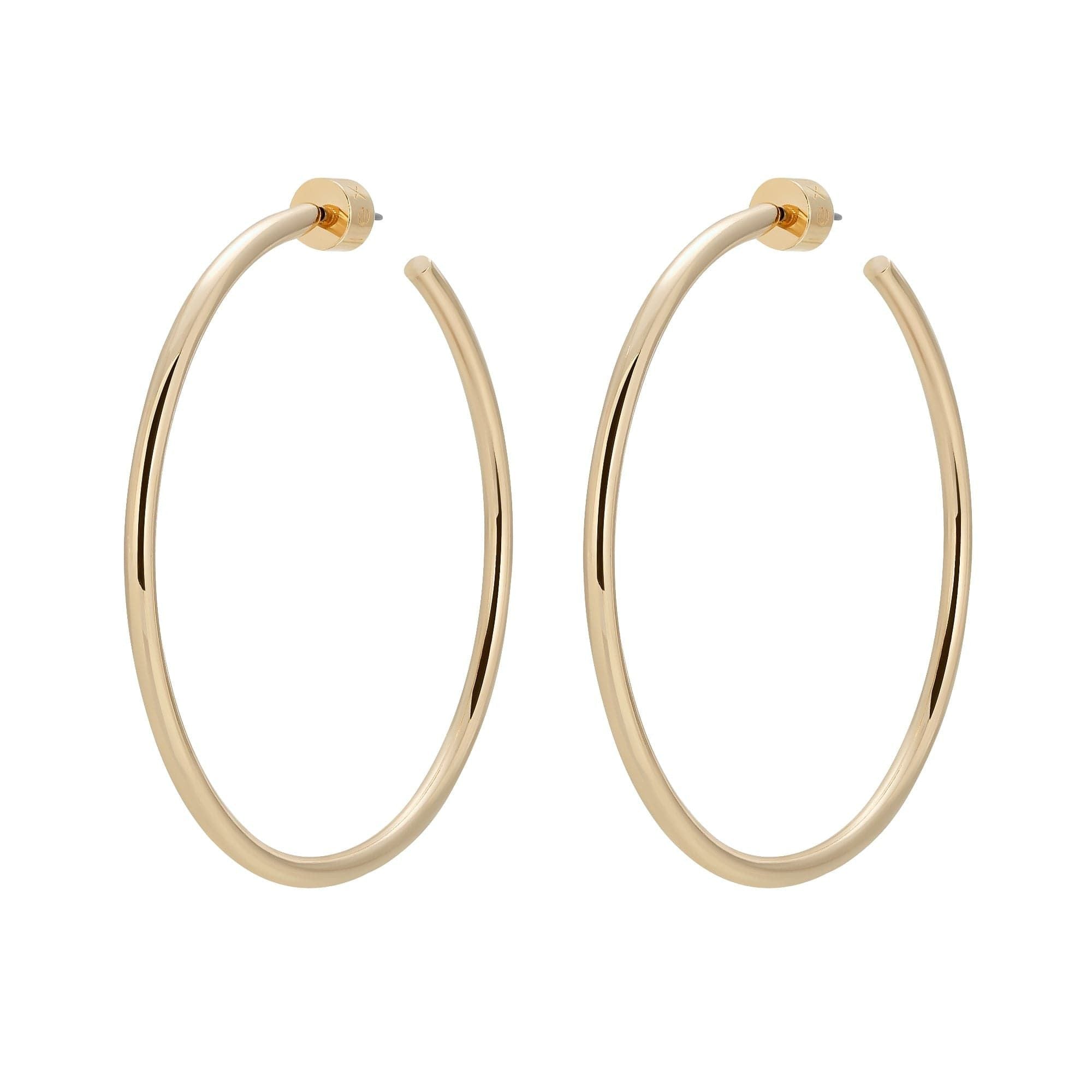 A pair of gold-colored hoop earrings made from recycled brass wire, displayed against a white background.