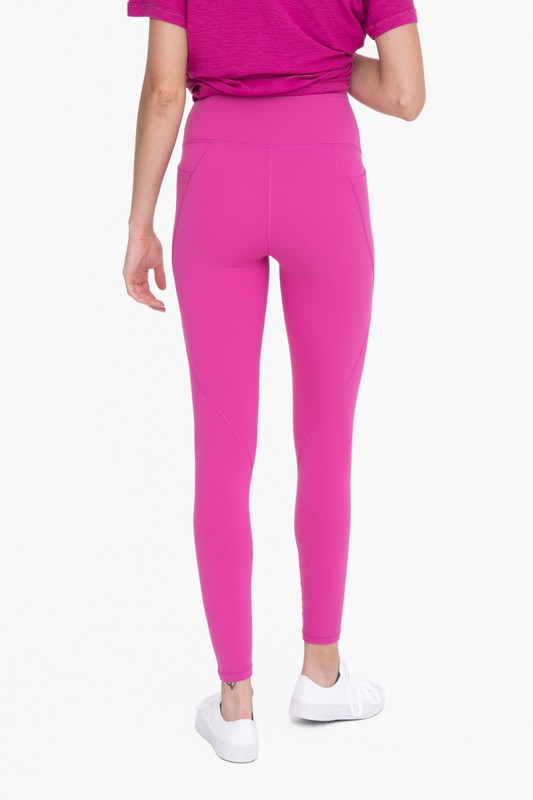 View of the back of Tapered Band Essential Solid Highwaist Leggings berry