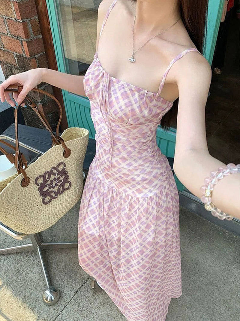 Woman wearing a pink dress with a straw bag in the background