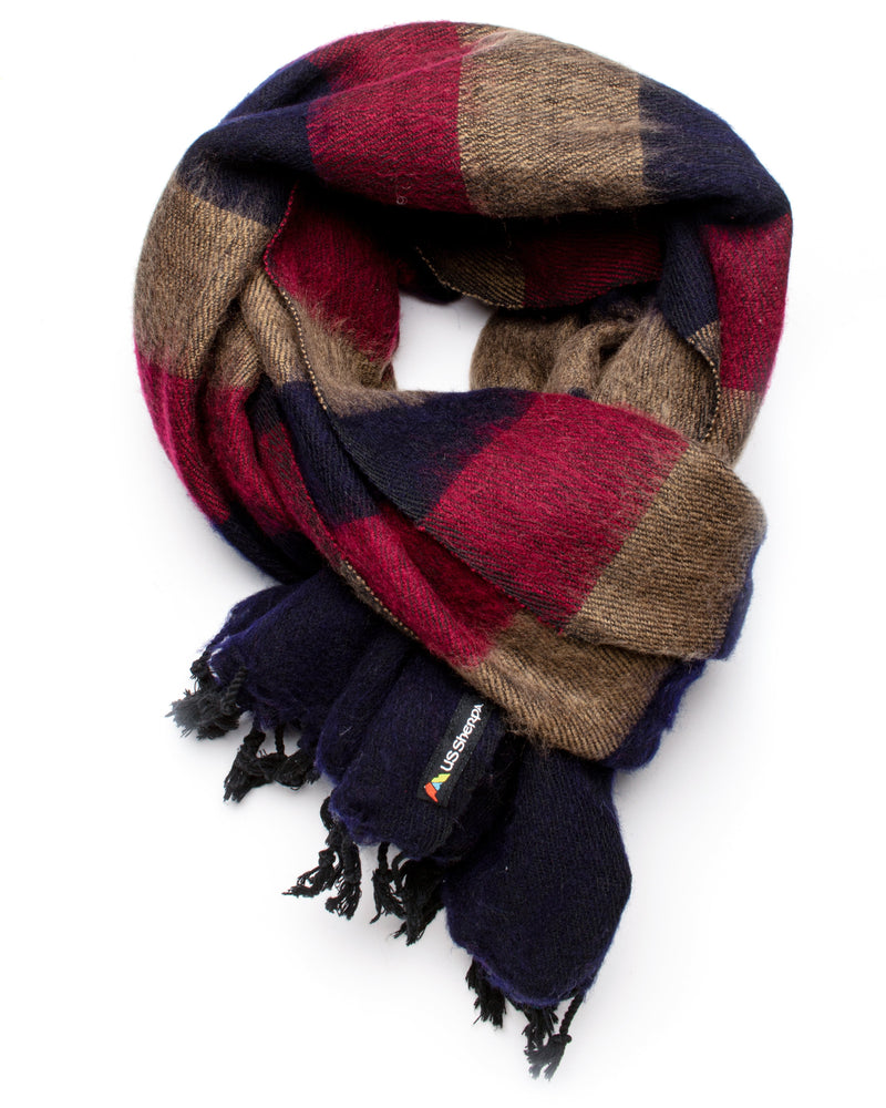 Plaid scarf with red, brown, and navy colors on a white background