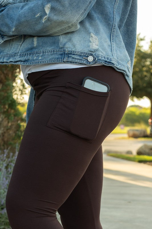 Cell phone in the pocket of FULL LENGTH Brown Solid Leggings
