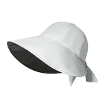 White sun hat with black interior on a white background
