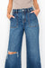 Model showing both pockets on ULTRA HIGH RISE RELAXED FLARE JEANS