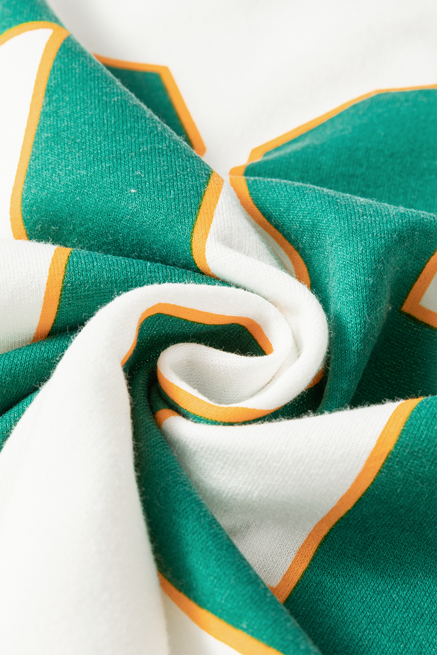 Close up view of fabric on Number 76 Round Neck Long Sleeve Top