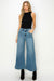 Model showing pocket of HIGH RISE CROP PALAZZO JEANS