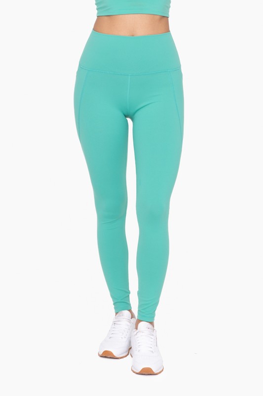 Front view of mint green Tapered Band Essential Solid Highwaist Leggings