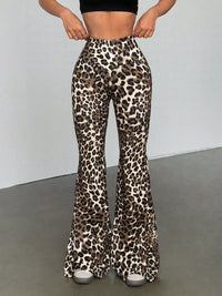 Leopard print flared pants worn by a person on a plain background