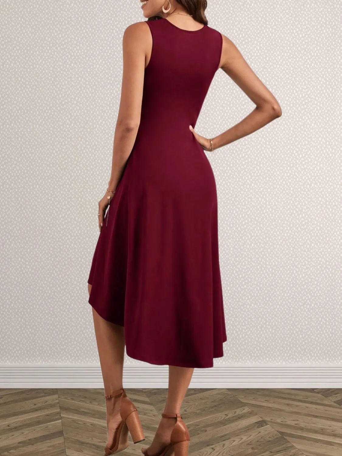 Burgundy dress worn by a person on a neutral background