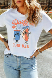 Person wearing a white t-shirt with a colorful graphic design and text.