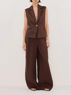 Brown sleeveless blazer and wide-leg pants on a white background
