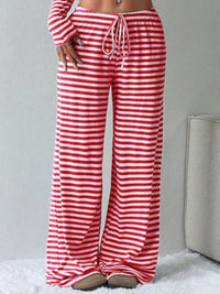 Red and white striped pants on a neutral background