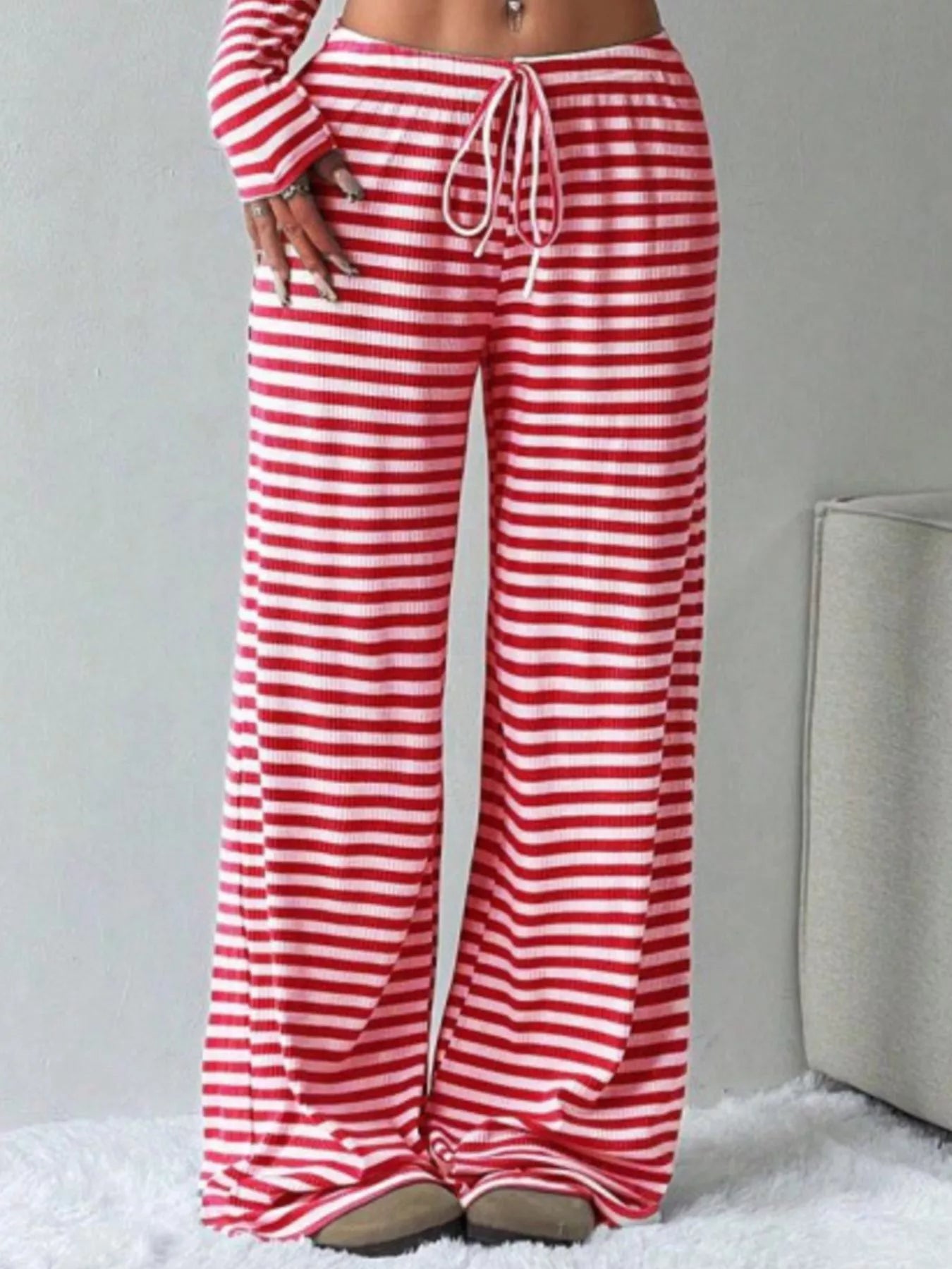Red and white striped pants on a neutral background